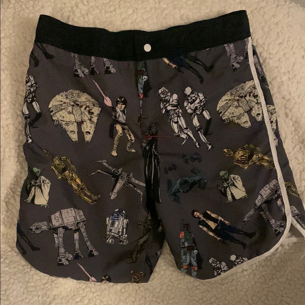 Star Wars Themed Swim Shorts. Side pockets and back zip pocket.  Mesh lining